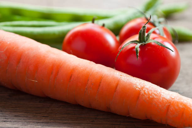 group of fresh vegetables on wooden background