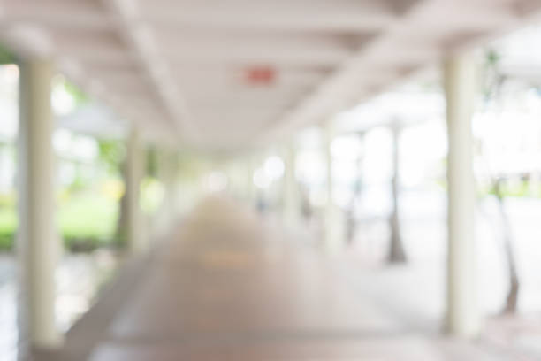 istock Abstract white blur background from corridor at building for design 845993162