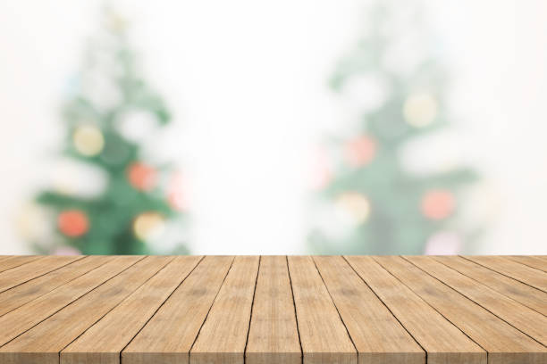 istock Empty wood table top on blurred background from christmas tree,space for montage you products 845993214