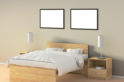 Two blank horizontal posters in bedroom over wooden bed. Isolated with clipping path around poster frame. 3d illustration