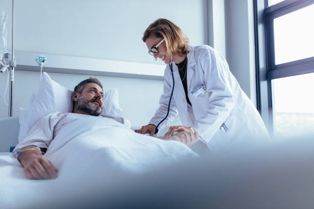 istock Doctor examining patient pulse in hospital room 846003098