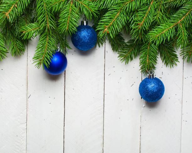 istock Christmas and New Year background. Christmas tree branch on a white planc background. View from above. 846006072