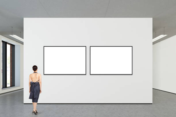 istock Woman looking at blank poster in modern gallery 846006916