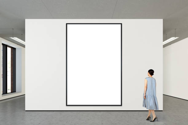istock Woman looking at blank poster in modern gallery 846009844