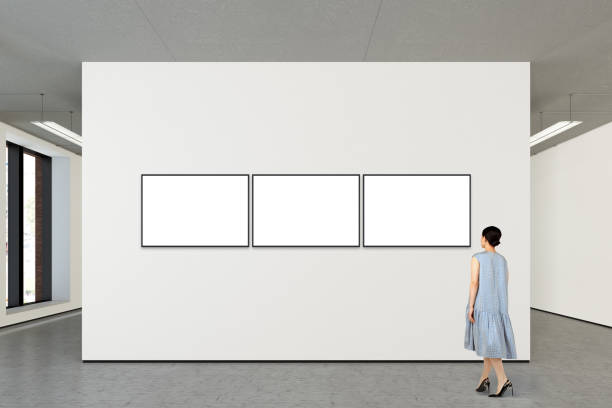 istock Woman looking at blank poster in modern gallery 846011210