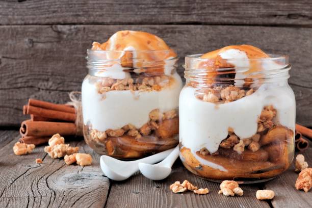 istock Caramel baked apple parfaits in mason jars on rustic wood 846011428