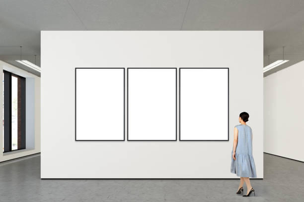 istock Woman looking at blank poster in modern gallery 846011532