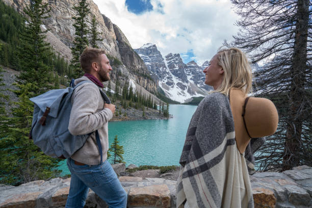 istock Young couple enjoying Moraine lake, Canada 846011676