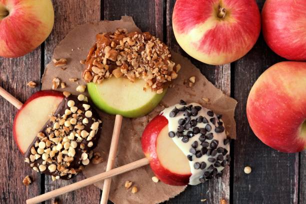 istock Candy dipped apple rounds, above on wood 846011852