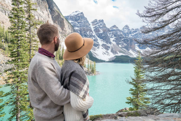 istock Young couple looking at Moraine lake, Canada 846014038