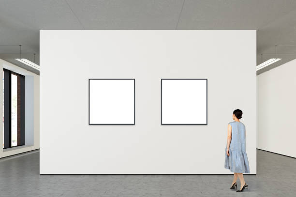 istock Woman looking at blank poster in modern gallery 846014228
