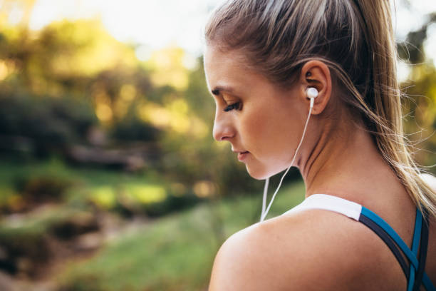 istock Woman runner wearing earphones during workout 846014456