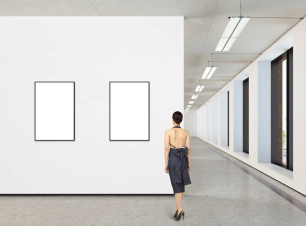 istock Woman looking at blank poster in modern gallery 846014464