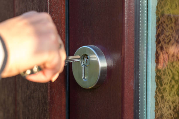 istock Open the wooden door with the key close up 846014792