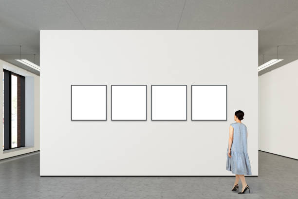 istock Woman looking at blank poster in modern gallery 846014948