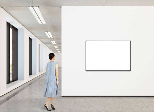 istock Woman looking at blank poster in modern gallery 846014996