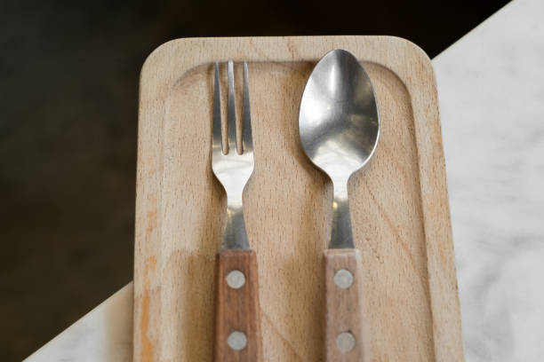 istock Cutlery for dessert on wooden plate 846015220