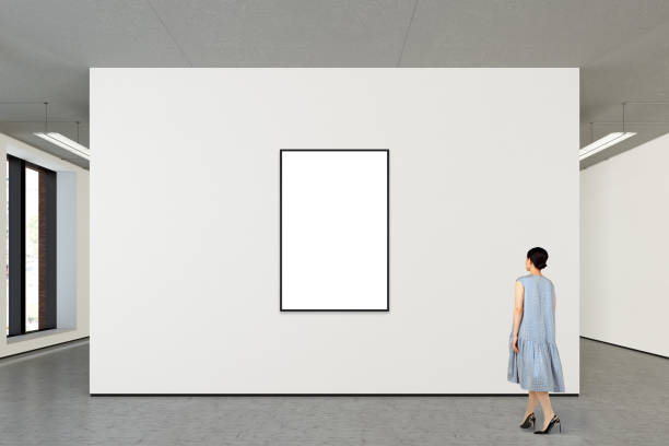 istock Woman looking at blank poster in modern gallery 846018024