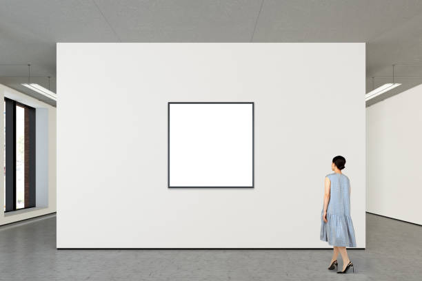 istock Woman looking at blank poster in modern gallery 846018170