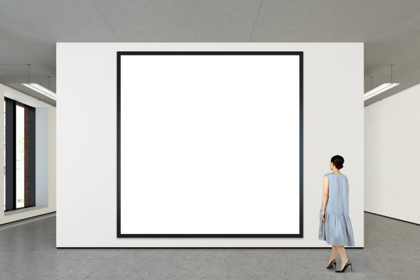 istock Woman looking at blank poster in modern gallery 846018332
