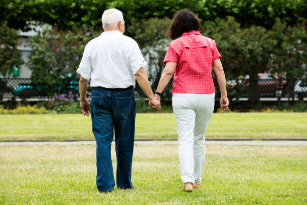 istock Couple Walking In Park 846022588
