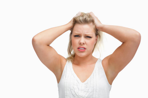 istock Upset woman standing while placing her hands on her head 846026106
