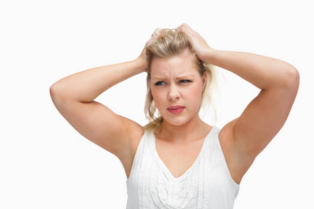 istock Serious blonde woman placing her hands on her head 846026138