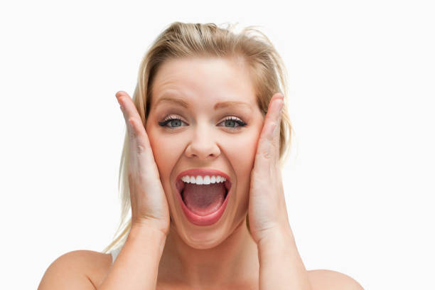 istock Happy blonde woman standing while showing her surprise 846028954
