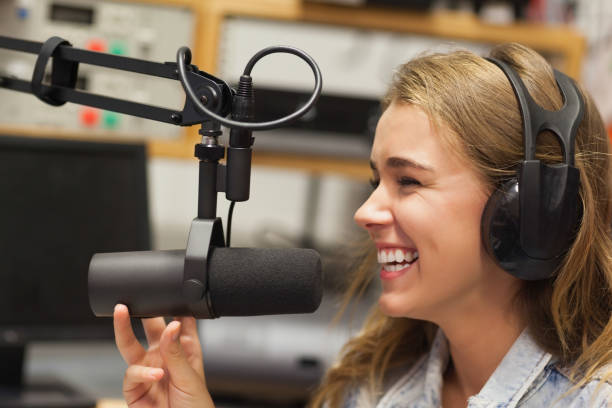 istock Laughing pretty radio host moderating 846029028