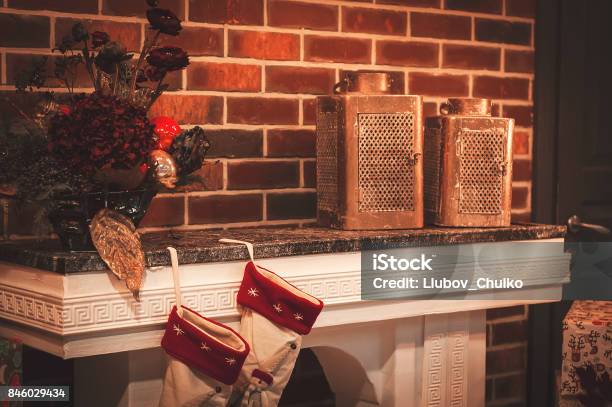 Christmas Room And Decoration Christmas Socks On Fireplace With Vintage Candlesticks Stock Photo - Download Image Now
