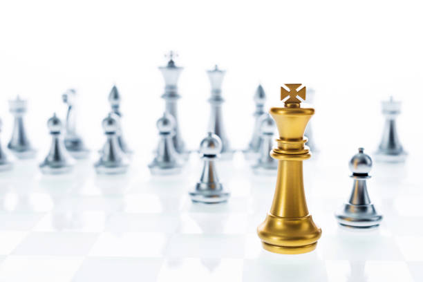 istock Golden king in front of silver chess pieces 846029814