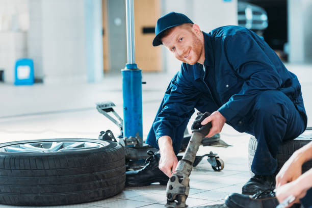 istock Automechanic holding car part 846030326