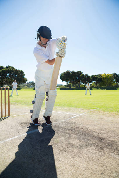 istock Full length of batsman standing on pitch 846032402