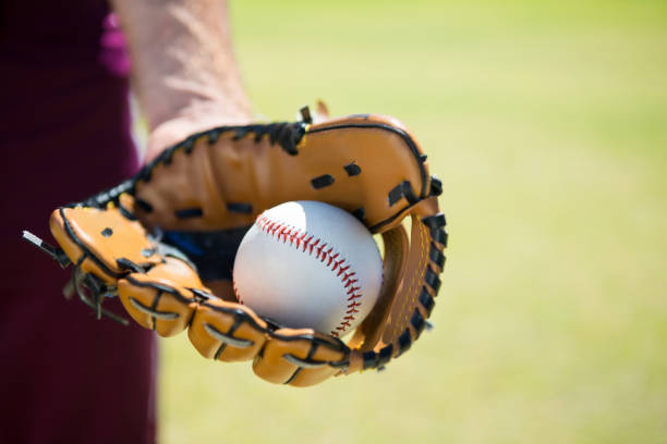 istock Cropped image of baseball pitcher holding ball on glove 846033482