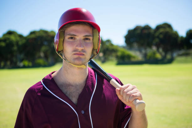 istock Portrait of young player holding baseball bat 846033546