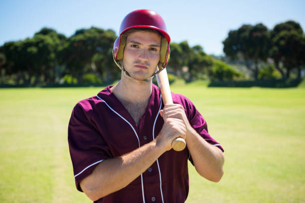 istock Portrait of young baseball player holding bat 846033598