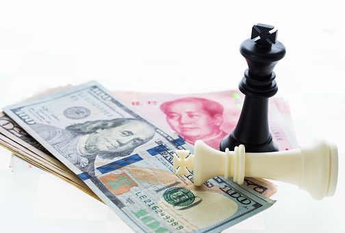 Chess pieces and paper currency