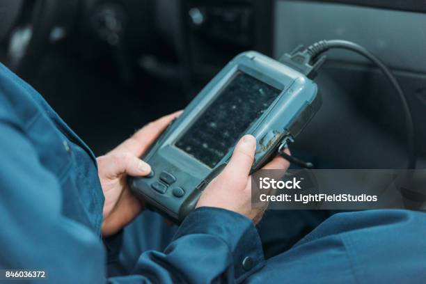 Automechanic Using Car Diagnostic Tool Stock Photo - Download Image Now - Car, Medical Exam, Medical Scanner