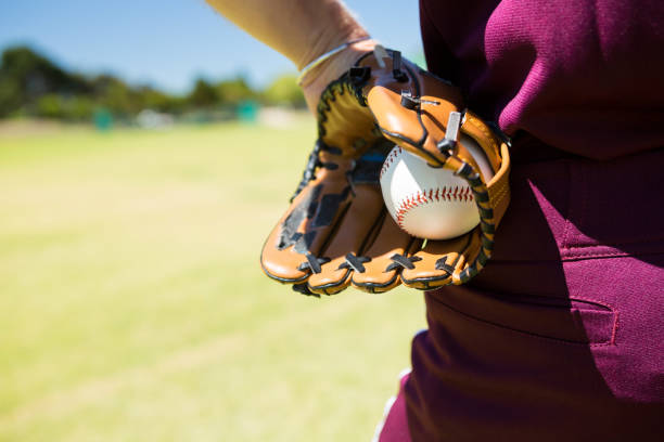 istock Mid section of baseball pitcher holding ball in glove 846036414