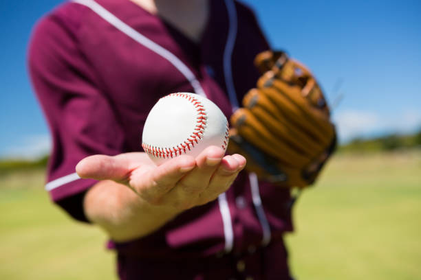 istock MId section of baseball pitcher holding ball on palm 846036462