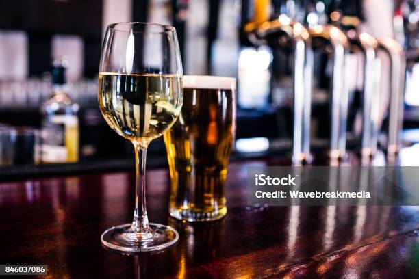 Close Up Of A Glass Of Wine And A Beer Stock Photo - Download Image Now - Beer - Alcohol, Wine, Pub