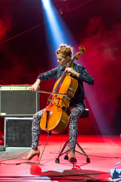 istock Young female musician playing cello on stage 846037096
