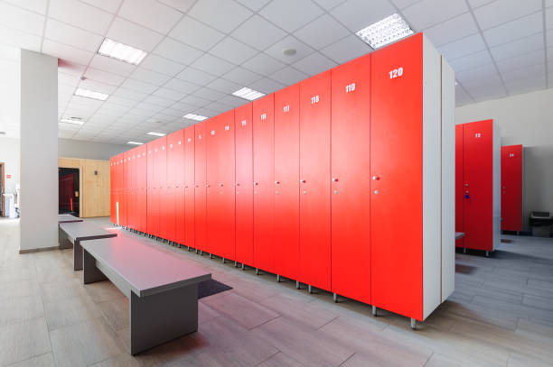 Interior of gym locker room Interior of gym locker room, red, grey and white colored locker room stock pictures, royalty-free photos & images