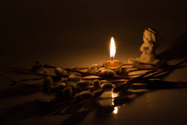 istock Angel and  burning candle 846044078