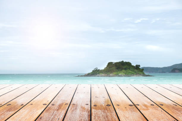 istock Empty wooden table with party on beach background blurred. 846047710