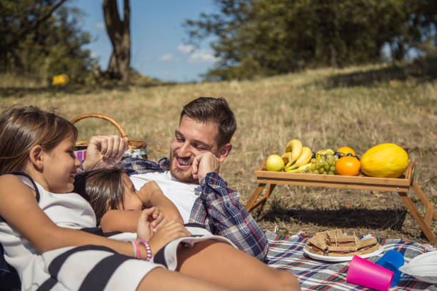 istock Cheerful happy family picnicking 846048246