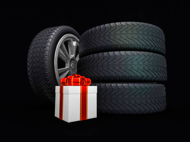 istock Car wheels with big white gift box, black background. 3D rendering 846049906