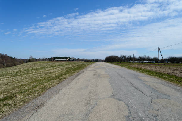 istock country road in forest 846054402