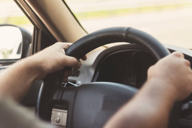 istock man's hands on the steering wheel retro toning car 846054934