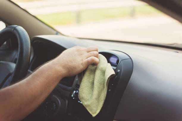 istock A man's hand wipes a carpet with a rag in a retro tint 846054968